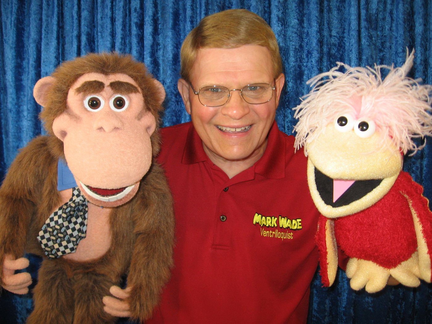 Mark Wade performing with two of his puppet characters